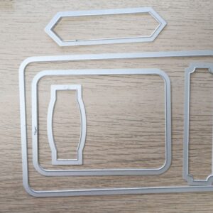 Project Life Cards & Labels Framelits Dies set of 5 metal dies displayed on wooden background