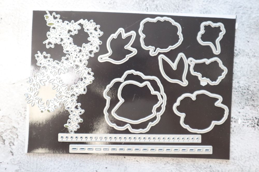 Blossoming Happiness Dies laid out showing floral and border shapes