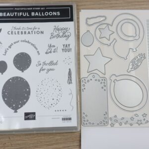 Beautiful Balloons stamp set case and coordinating dies displayed on a wooden surface.