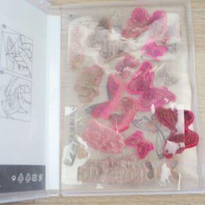 Used Butterfly Gala stamps displayed inside the storage case.