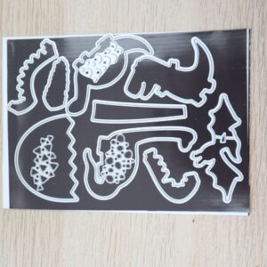 Dino Dies arranged on magnetic sheet.