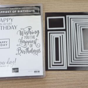 Happiest of Birthdays stamp set displayed alongside stitched rectangle dies.