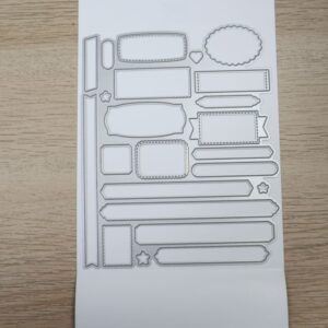 Many Messages coordinating dies with assorted stitched labels and tags