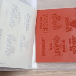 Inside view of Heartfelt Hellos cling stamps with red rubber stamp sheet