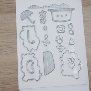 Coordinating Hippo Dies laid out on a magnetic sheet with hippo outlines and accessory dies.