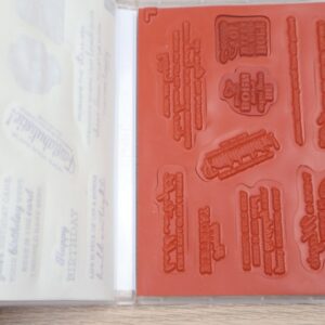 Open In Your Words stamp set showing red rubber cling stamps inside the case.