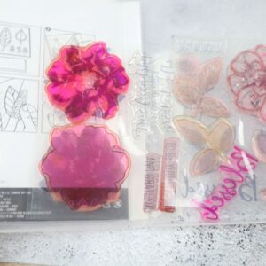 Used To a Wild Rose photopolymer stamps inside the case with floral and sentiment images