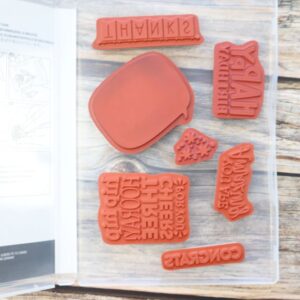 You Are Amazing cling stamps displayed inside the case.