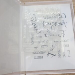 Create with Friends photopolymer stamp set open in case showing all 17 clear stamps